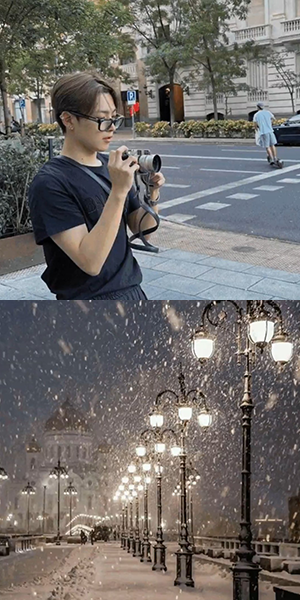 hongjoong with a camera taking a picture / a snowy street lined with street lamps